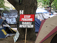 Anti Jewish signs in Occupy's "Sacred Place."  Photo by Citizen Journalist Bruce McCain.