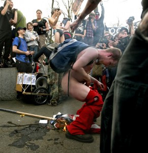 Protester poops on flag