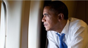 Obama looking out the window of Air Force One. Not at the border, though. He doesn't even have time for that. 