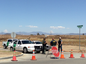 Agents block the entrance to the Murrieta, California Border Patrol facility on July 7th. Photo by Victoria Taft for www.VictoriaTaft.com