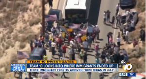 Protesters stop buses from dropping off Central American illegal aliens.